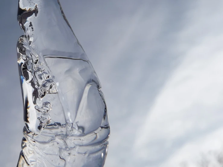 a clear water bottle with nozzles in it