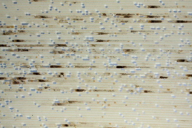 a large wall with blue dots and white spots