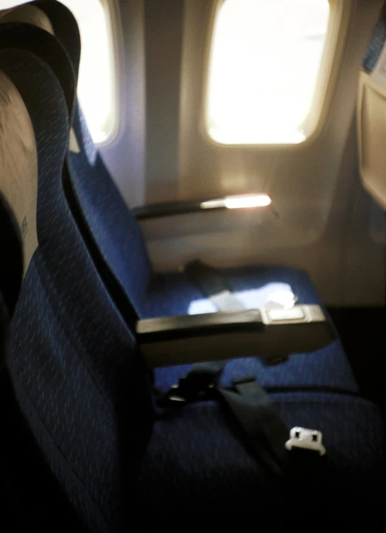 an empty seat on an airplane in the middle of the day