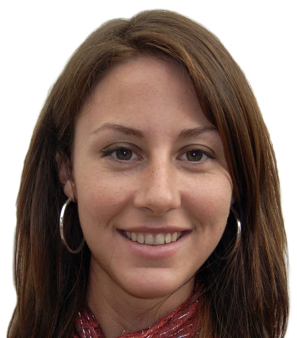 a woman with long brown hair smiles at the camera