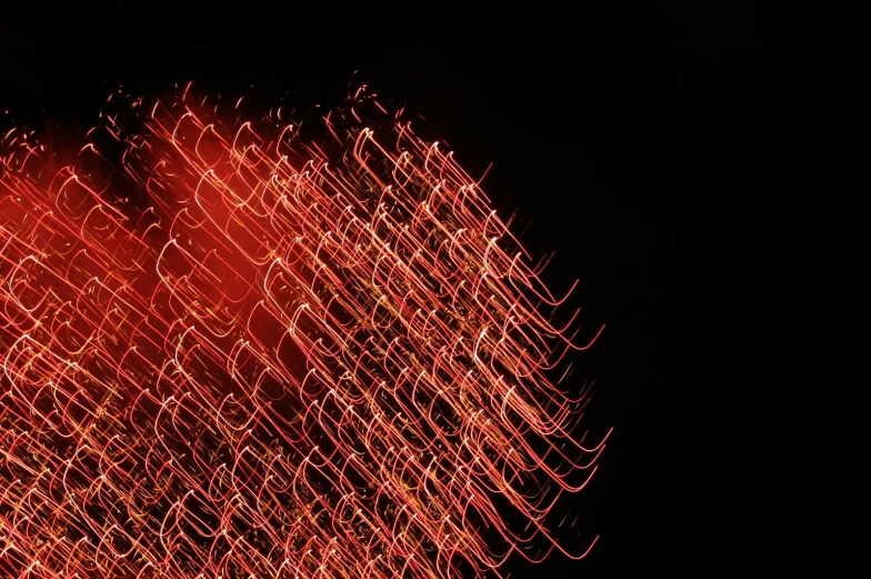 an image of fireworks that appears to be in the dark sky