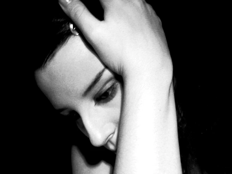 a close - up of a young woman wearing a watch