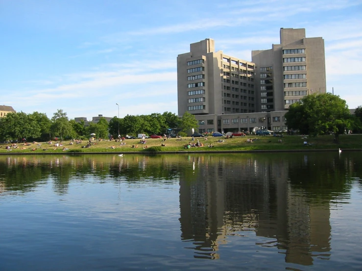 a body of water in front of a large building