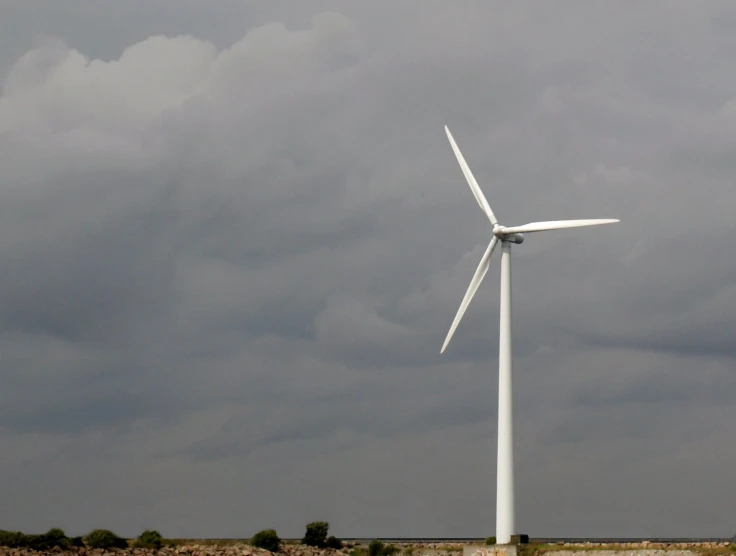 the wind turbine is on a cloudy day