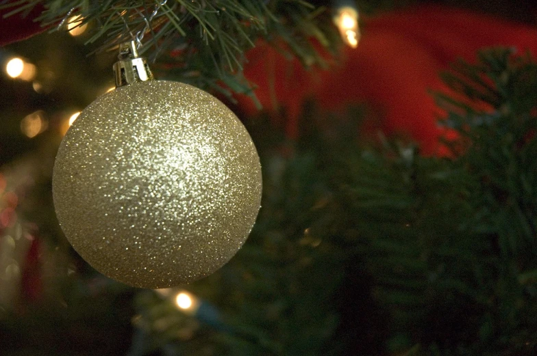 an ornament on the christmas tree is light - up