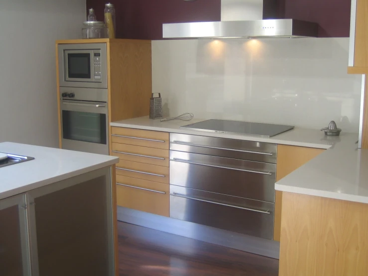 the kitchen has stainless steel appliances and cabinets