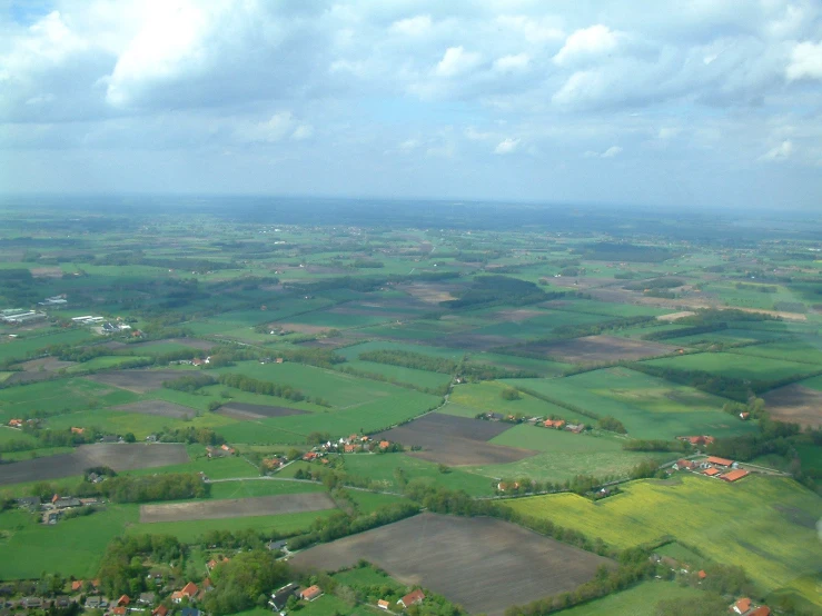 an aerial view of many different fields and farms