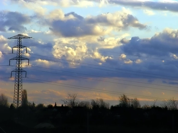 a large tower with lots of electrical wires