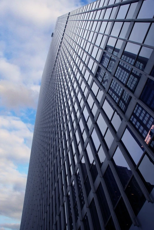 a very tall building with many windows next to it