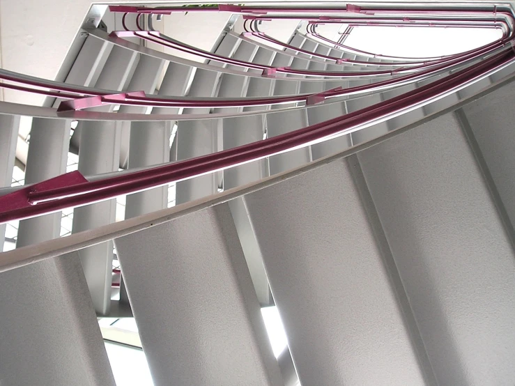 the metal shades in this room have lines of red and pink bars on them