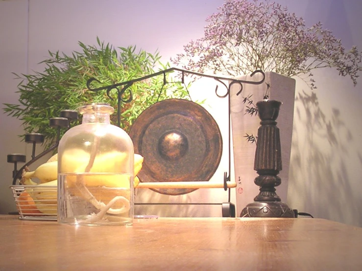 vases and bottles on top of a wooden table