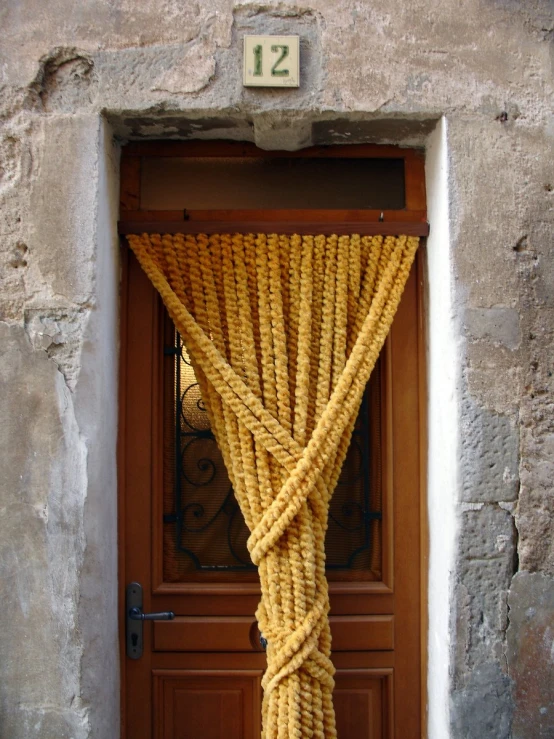 a door with a rope hanging from it's side