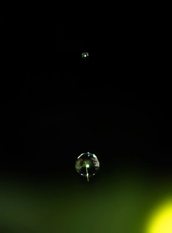 a drop of water sitting on top of a table