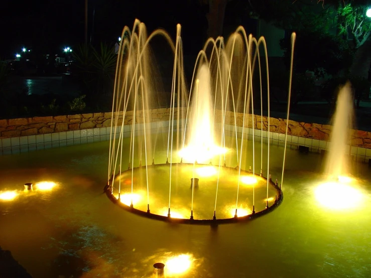 a couple of fountains that have lights on them