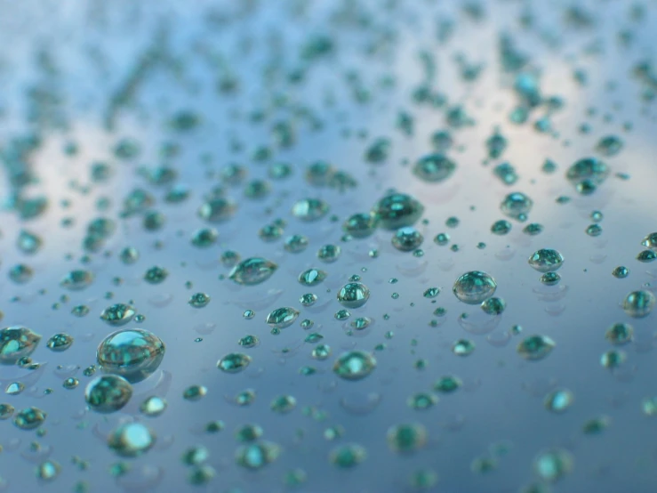 a view of drops of water on a windshield