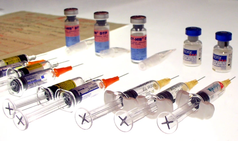 a collection of injection bottles and other medical supplies