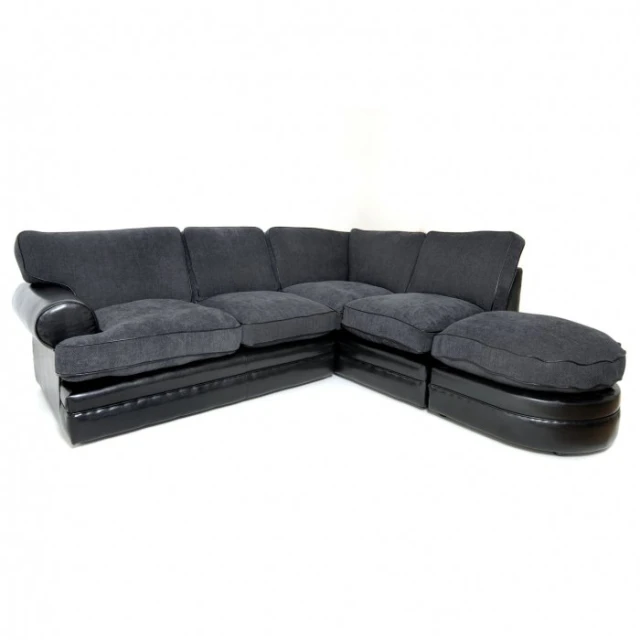 the black sectional sofa has three sections with cushions