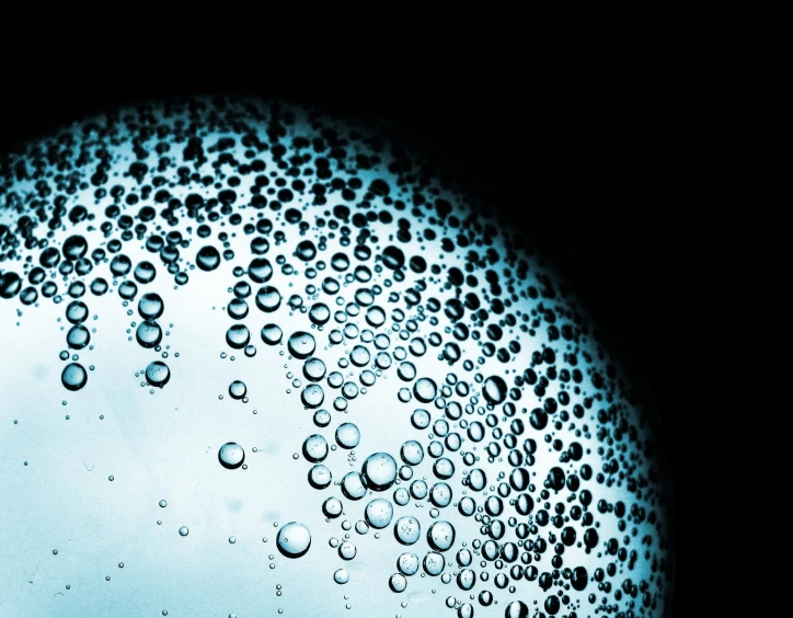 close up water bubbles in front of a light