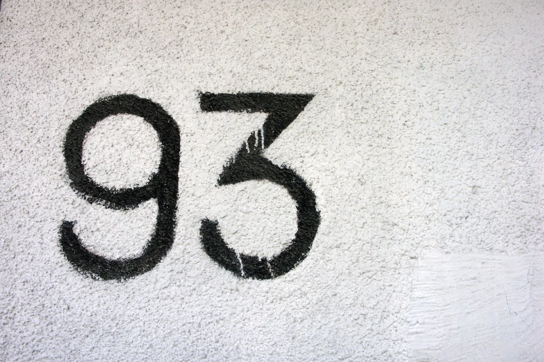 number twenty five written on sand as part of a wall mural