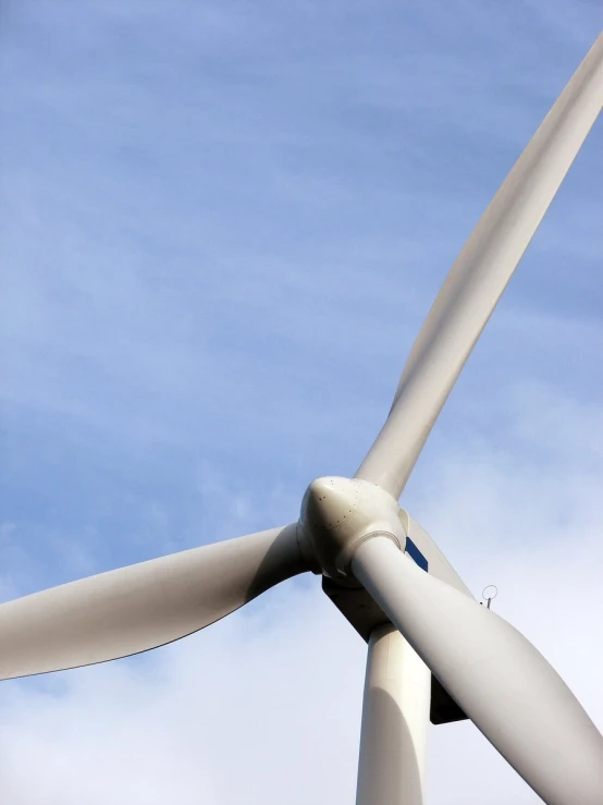 a large metal pipe in the shape of a wind turbine