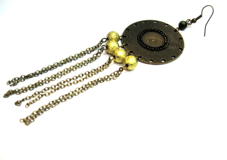 a black and gold chain tassel necklace with bead details