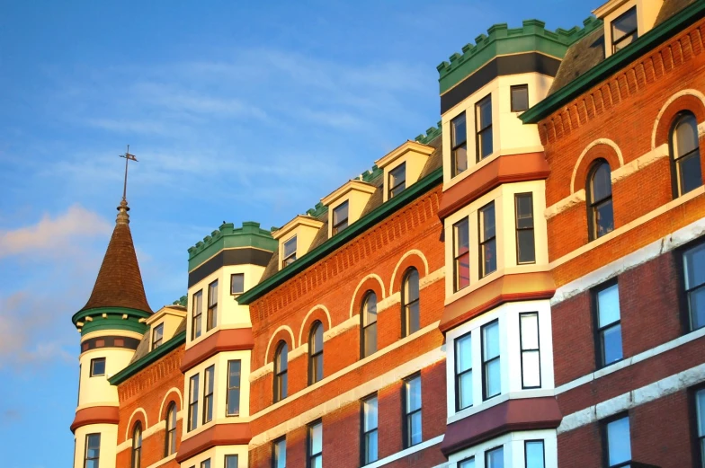 a building with many windows and the sky in the background