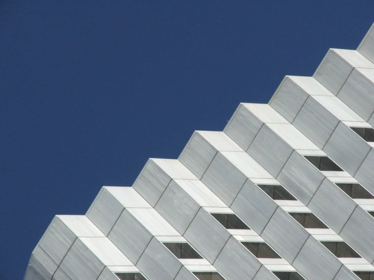 the corner of a building against a blue sky