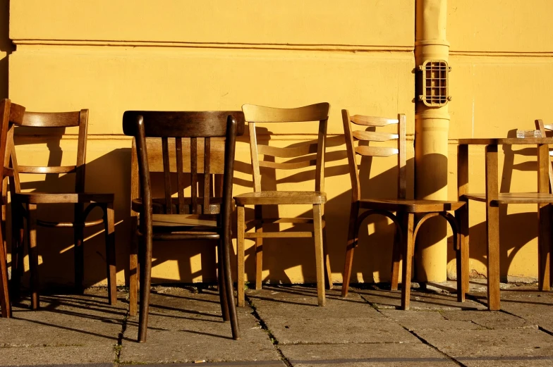 a number of chairs standing on the ground