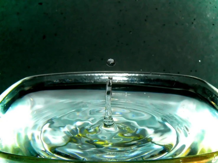 a bowl of water that is being filtered