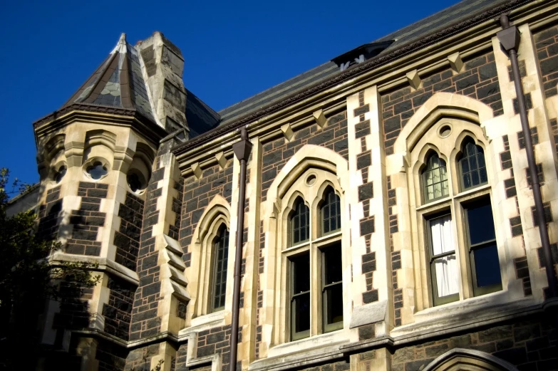 the roof of a gothic building features elaborate carved architecture