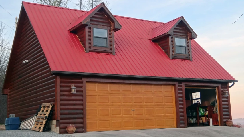 the garage has two windows and red roof