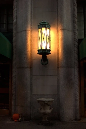 a street lamp is on the side of a building