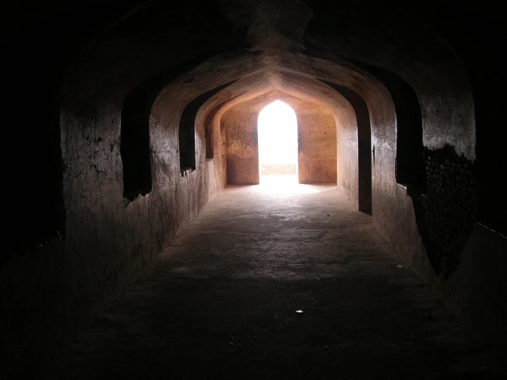 an tunnel is shown with the light at the end