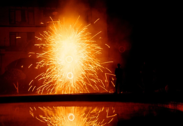 a firework that looks like fireworks reflected in water