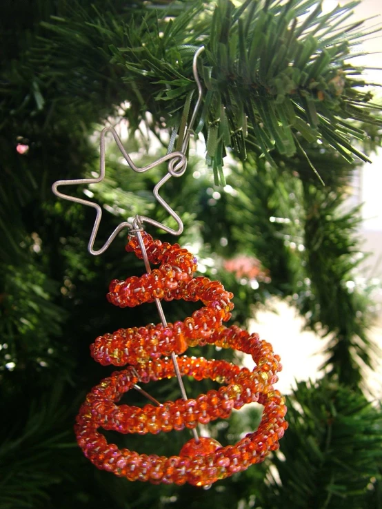 a christmas ornament hanging from a tree