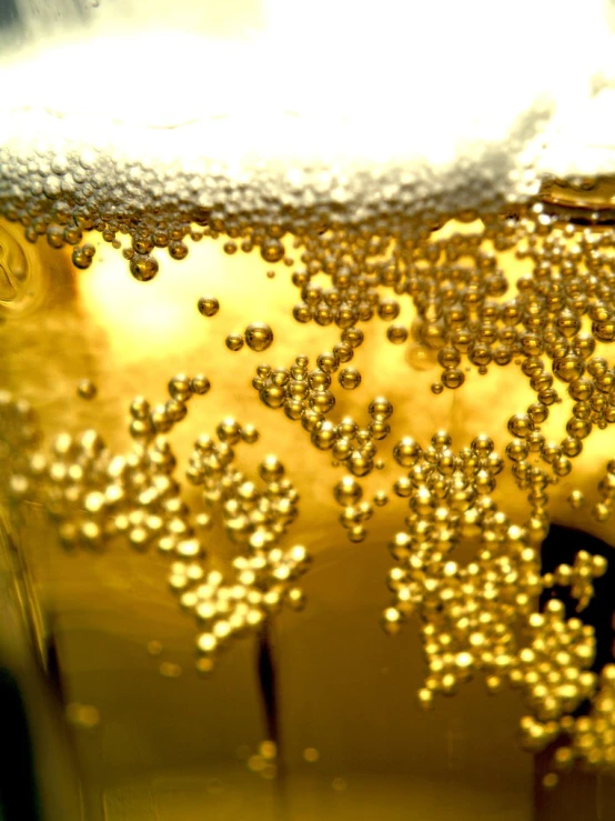 bubbles are all over a glass of liquid