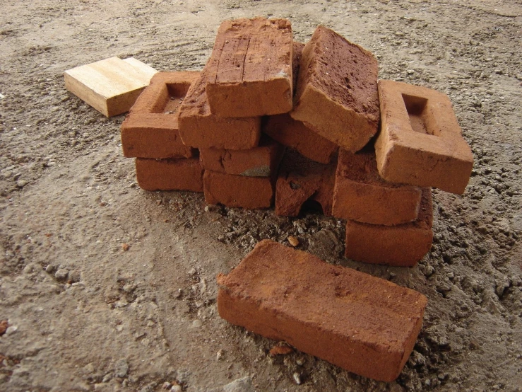 some bricks that are laying on the ground