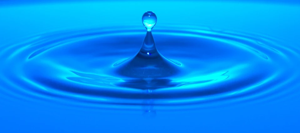 a blue water droplet with water droplets