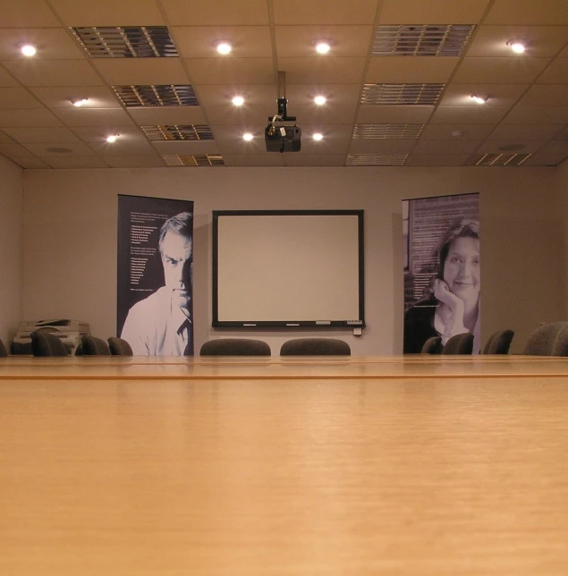 conference room with a television and long chairs