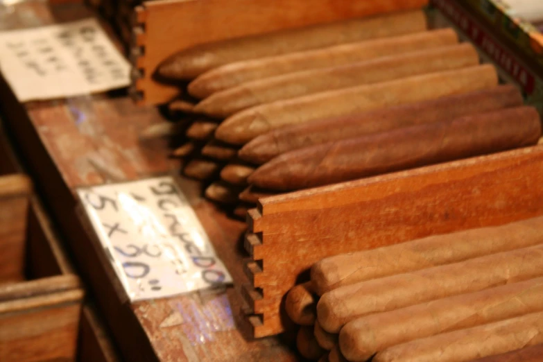 a bunch of different types of cigars sitting on display