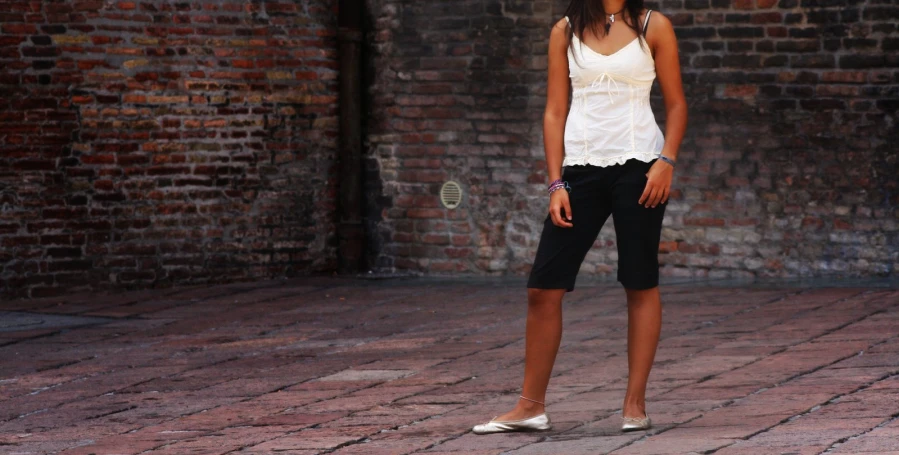 a woman standing with her hand on her hip