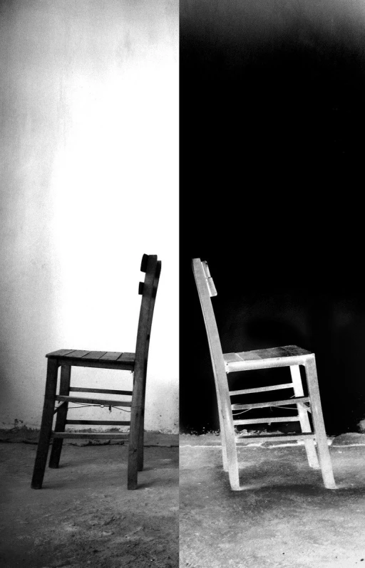 a black and white image with two different chairs