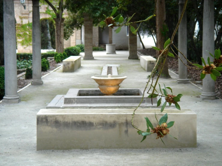 some benches and vases in a courtyard