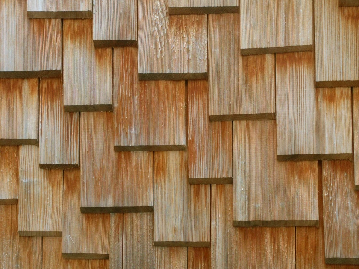 a close up of an elaborate wooden wall panel