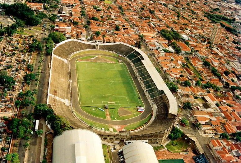 an aerial view of a stadium, with a baseball field in the middle
