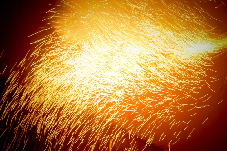 the bright yellow fire works to create a pattern