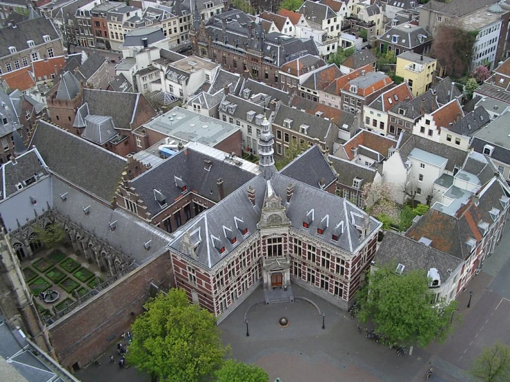 a wide view of some buildings with trees and grass