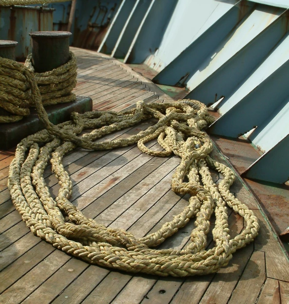 an old rope sits on the deck of a ship