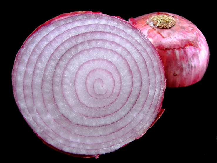 an onion that is sliced and still on the side
