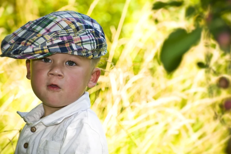 the  is dressed in plaid attire and hat